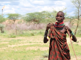 Turkana herder by gas flare